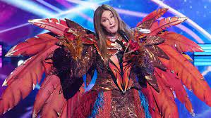 One celebrity is unmasked from group a, and the remaining singers advance; Caitlyn Jenner On The Masked Singer Her Phoenix Gets Eliminated