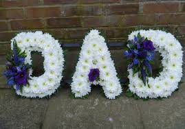 Loose cushion mixed lilac, purple and white from £70.00. Dad Based Lettering Greenery Edge Sherwood Florist Florist Havant Flowers Gifts Balloons Weddings Funerals