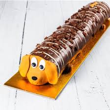 A twinkie is an american snack cake, described as golden sponge cake with a creamy filling. Asda Is Selling An Adorable Sid The Sausage Dog Cake