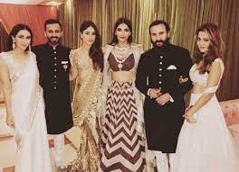 Anand matched her look in his long onion pink jacket and white trousers. Bollywood Exes Who Attended Sonam Kapoor S Wedding Together