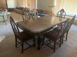 A set of six walnut dining chairs with padded seat and backs, the frames with a jacobean style frames with hand carved details. 1900 1950 Jacobean Dining Room Set Vatican