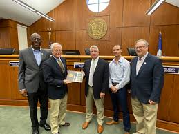 Congratulations to our mayor and all our members of City Council! Eric  Budds, MASC Deputy Executive Director, presented a plaque recognizing the  mayor and all councilmembers as being graduates of the Municipal