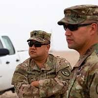 Pakistani Army Major General (MGEN) Javed Aslam Tahir (left), Commander of  Pakistani Army Aviation, US Navy (USN) Rear Admiral (RADM) (upper half)  Michael "Mike" A. Lefever (center), Commander, Disaster Assistance Center  Pakistan,