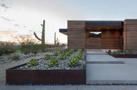 River Rocks And Corten Steel Earth Homes Rammed Earth Homes Architecture
