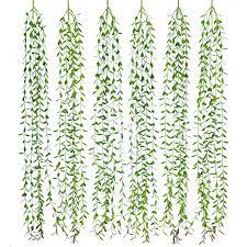 This artificial vine is perfect for adding a splash of color to any room. Coolmade 6pcs Artificial Vines Fake Greenery Garland Willow Leaves Artificial Flowers With Total 30 Stems Hanging Plant For Wedding Party Home Garden Wall Decoration Walmart Com Walmart Com