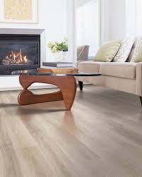 Pergo flooring in downstairs, fireplace, beautiful kitchen, with ss appliances …. With Light And Dark Undertones This Pergo Max Premier San Marco Flooring Matches All Shades And Colo Laminate Flooring Colors Pergo Flooring Laminate Flooring