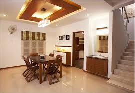 Dining Room With Wooden Suspended Ceiling Savio And Rupa Interior Concepts Bangalore Professional Villa I Ceiling Design False Ceiling Design False Ceiling