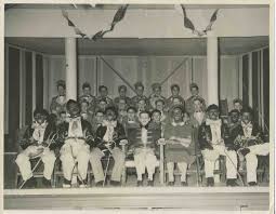 The image (left) depicts an advertisement for the morris brothers minstrel group. Montreal Catholic School Minstrel Show Gatherings Partnership
