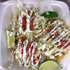 A gourmet food truck with a variety of delectable items, all containing fresh produce from organic farms. Del Solar Fish Tacosa Los Angeles Roaming Hunger