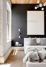 Black And White Brick Wall Design White Brick Wall Black Wall Wood Ceiling White Light Fixture White Bedding Fur Throw Blanket Black And White Bedroom Interior Bedroom Design Home Trends