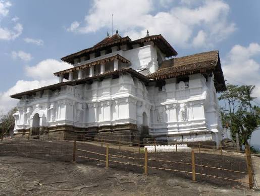 Lankatilaka Vihara rock outcrop 172 stone steps paddy fields onion dome Sinhalese South Indian architecture Gampola era Sri Lanka