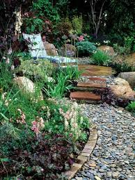 The covered seating area is covered with stone tiles. 13 Inspiring Garden Design Ideas With Rocks
