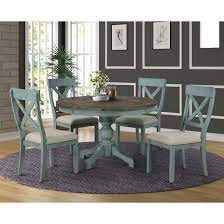 Featuring clean lines, this table is easy on the eyes with its roughhewn wood surface and natural textures that add stylish charm. The Gray Barn Spring Mount 5 Piece Round Dining Table Set With Cross Back Chairs On Sale Overstock 27175688