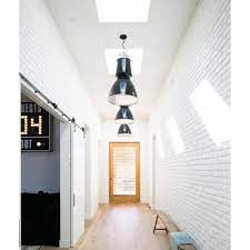 For some lucky homeowners, stripping away an ugly drywall is all it takes to reveal a beautiful brick wall that lends itself to a range of interiors styles; White Exposed Brick Industrial Details In Hallway White Brick Brick Interior Hallway Designs