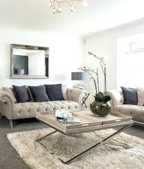 A white sofa matching the wall and floors sets the stage for cream vintage joe colombo chairs that flank a custom. Fun Sources Grey And Cream Living Room