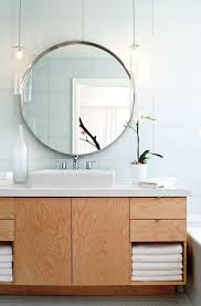 Narrow Low Hanging Ceiling Pendants Can Extenuate The Height Of The Bathroom Creating Vertical Round Mirror Bathroom Bathroom Lighting Modern Bathroom Design