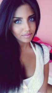Black hair with caramel highlights. I Wish I Could Naturally Have This Look Black Hair Light Blue Eyes And Tan Skin Sigh Dark Hair Blue Eyes Black Hair Blue Eyes Dark Hair