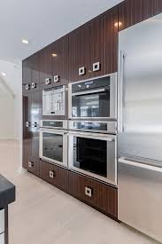 Wall Of Kitchen Cabinets Features Built In Appliances Kitchen Design Small Cottage Kitchen Kitchen Remodel