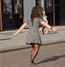 Girl dancing in minidress and pantyhose Stock Photo | Adobe Stock