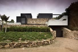 local rock house by pattersons wowow home magazine in 2021 house on the rock front elevation designs waiheke island