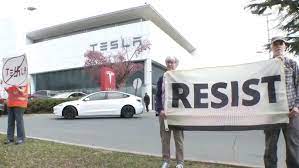 Protesters at League City Tesla dealership demand Elon Musk step down from  controversial DOGE role - YouTube