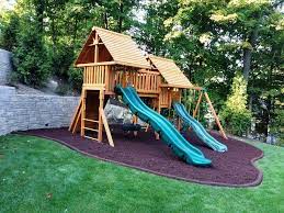 Playground On A Sloped Back Yard With Recycled Rubber Mulch And Borders Playsafe Playground Recycle In 2021 Playground Mulch Playground Landscaping Sloped Backyard