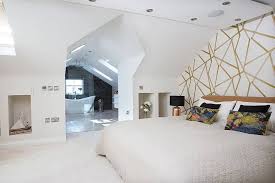 Add a touch of frost sectioning off an area of a bedroom to create an en suite can leave the bathroom without a window. Open Plan Master Bedroom Loft Conversion Real Homes Living Room Loft Loft Conversion Bedroom Bedroom Layouts