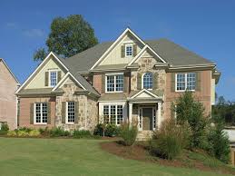 Brick house with metal roller shutters on the windows. 32 Gorgeous Houses With Exterior Window Shutters