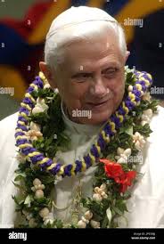 Pope Benedict XVI wears flower necklaces donated by pilgrims and faithful  at the end of a special audience, in the Paul VI hall at the Vatican,  Monday, May 16, 2005. The special