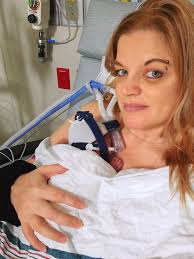 Pediatrician comforts nervous girl during blood draw