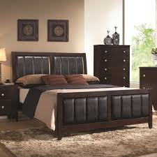 The exclusive coaster design features a modern style with a beveled picture frame designs on the imposing headboard and case fronts. Carlton Bedroom Set Adams Furniture
