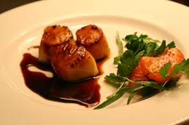 You caramelize sugar, combine it with equal parts vinegar, and reduce it slightly to make a tart, slightly thickened syrup. Sea Scallops With Pomegranate Gastrique And Herb Tangerine Salad Swellkid