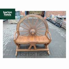 Reclaimed teak extending table and natural wicker chair set. Cartwheel Two Person Garden Seat Made From Reclaimed Teak Stoneware Furniture