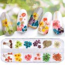 If you don't want your black nail design apper too dark or rebellious, just paint some pretty white flowers on it. Amazon Com 12 Color Nail Art Nature Dry Flowers Set Gel Polish Tip 3d Diy Floral Slices Decal Pro Manicure Pedicure Decor Newest Kit Natural Dried Petal Nail Art Decoration Beauty