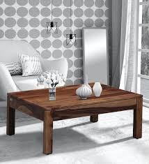 This rustic coffee table from sauder has all the qualities you might want or need in a living room furniture. Buy Enkel Solid Wood Coffee Table In Rustic Teak Finish Woodsworth By Pepperfry Online Square Coffee Tables Tables Furniture Pepperfry Product