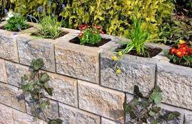 In the garden, you can use concrete blocks (or board formed concrete) to make: Cheap Retaining Wall Ideas Choosing Materials For Garden Walls