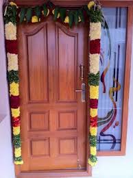 Nilai Maalai Flower Garland For Decorating Main Door Of The House Is Considered Auspicious Notice Those Mango Leav Main Door Design Door Design Doorway Decor