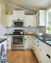 A stylish black and white kitchen by sara ray interior design combines open shelving with black shaker base cabinets. Slanted Ceilings For A Unique Touch In Your Home S Interior Decor Around The World Freestanding Kitchen Kitchen Remodel Small Black Kitchen Countertops