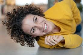 Portrait Of Happy Woman Lying On The Floor At Home Josf02714 Joseffson Westend61