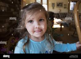 Portrait of girl sticking out tongue Stock Photo