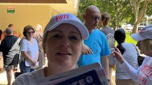 Gold Coast council candidate Samantha Delmege obstructs journalist, argues  with voter