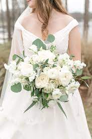 White wedding flowers for bridesmaids. Lush Loose And Elegant Bridal Bouquet In Classic White Flowers Of White Cloud Garden Rose White Bridal Bouquet Elegant Bridal Bouquets White Wedding Flowers
