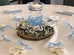This spring table setting incorporates decorative wooden eggs and fresh boxwood stems from the garden. Baptism Table Centerpiece Baptism Table Centerpieces Baptism Table Centerpieces