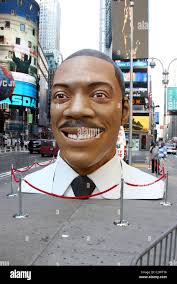 A 15 foot tall replica of Eddie Murphy's head is placed in Times Square to  promote the release of his new film 'Meet Dave'. New Stock Photo