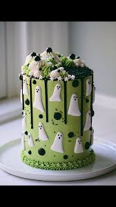 Watch how to make these easy ghost cakes here. My Ghost Cake I Piped Royal Icing Ghosts To Decorate This Chocolate Cake I Used Black Ganache For The Drips Halloween Cakes Ghost Cake Halloween Baking