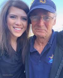 Man mourns wife at grave, appreciates hug