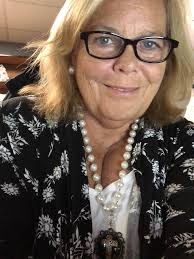 I was the Indian girl with platts holding a string of beads