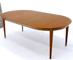 Select a round one for a smaller space like a breakfast nook and a large rectangle for a larger, more open layout. Round Walnut Tapered Legs Dining Room Table With Two Extensions Boards For Sale At 1stdibs