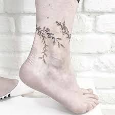 This tattoo features pretty blue flowers, plants and other flowers too. Ankle Bracelet Tattoos To Make Your Legs Look Graceful