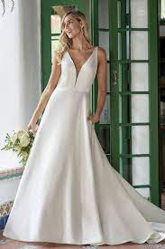 Luxurious fabrics, such as satin and chiffon, with exquisite beading or pearls, give a classy display. F211003 Gorgeous Italian Satin A Line Wedding Dress With V Neckline